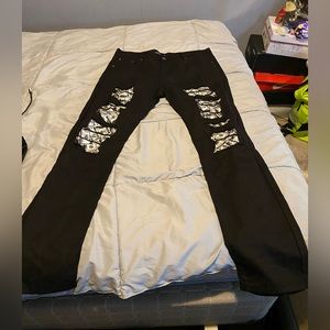 Black denim pants ripped jeans